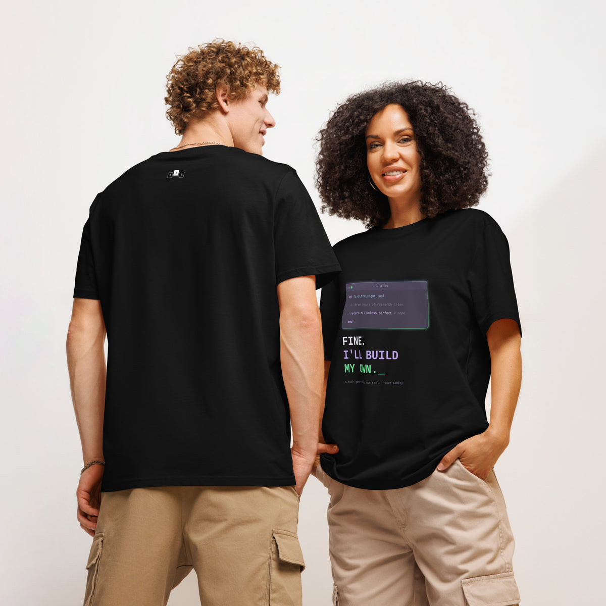 Two models wearing black Fine. I'll Build My Own developer T-shirts, front and back view